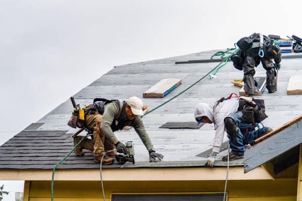 Professional Roofing technician working in Medfield, MA